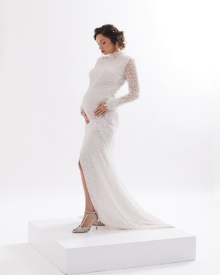 Sophisticated mermaid wedding dress with half roll, open back and deep slit