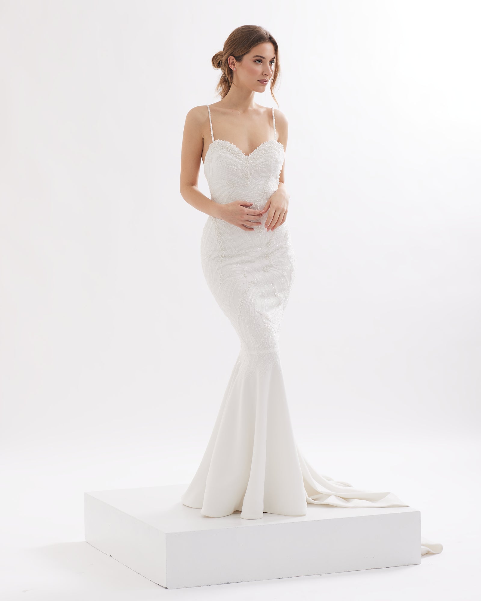 Refined mermaid wedding dress with pearls and open back
