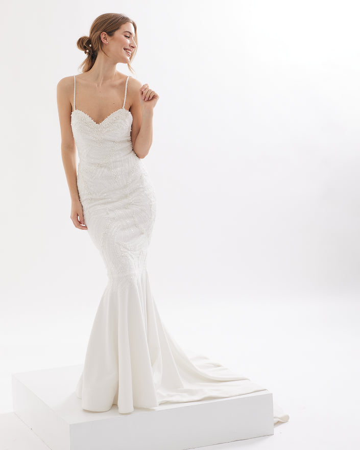 Refined mermaid wedding dress with pearls and open back