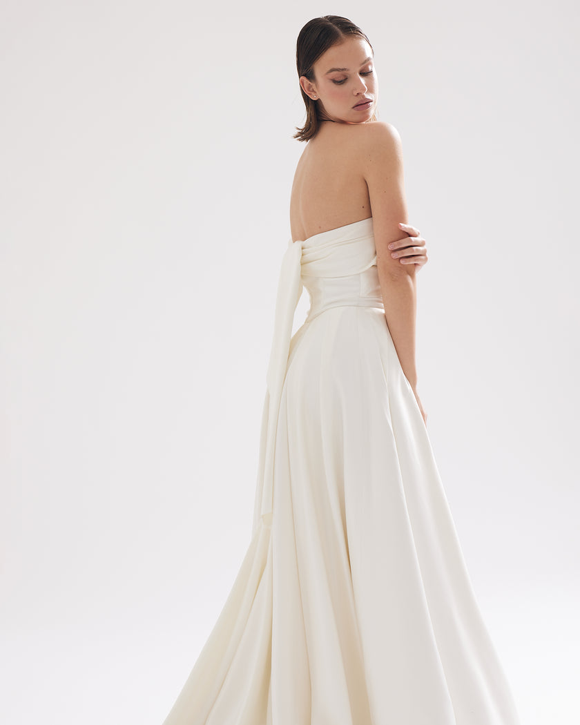 Modern corset-style wedding dress with pleats and dropped straps