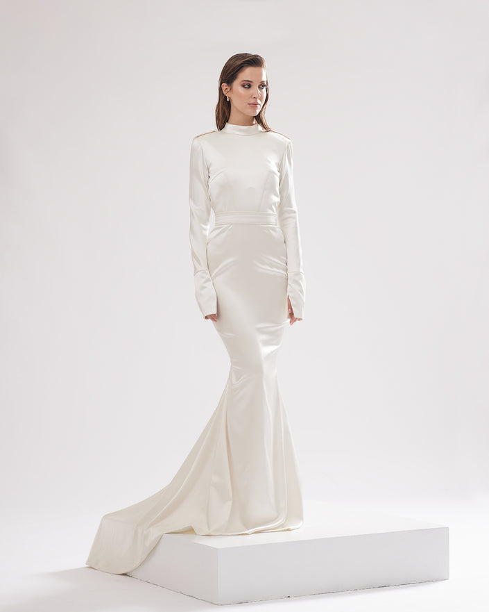 Minimalistic wedding dress with open back, semi-skirt and cuffs