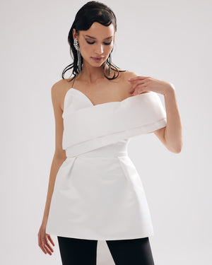 Little white statement dress with a unique detail