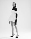 Llittle white statement dress with dropped shoulders and cuff