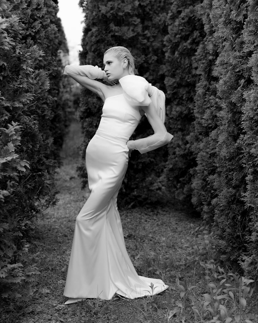 Unique mermaid cut wedding dress with neck detail and puff bow