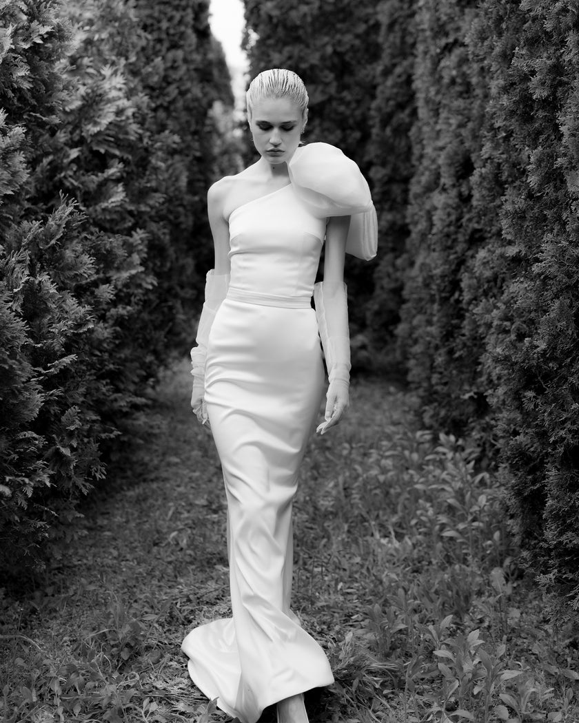 Unique mermaid cut wedding dress with neck detail and puff bow