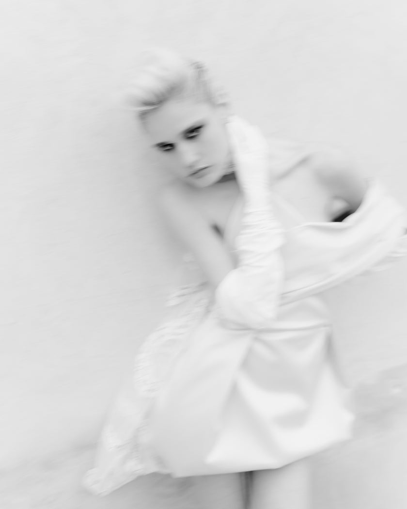 Sophisticated short dress with dropper shoulder and detail